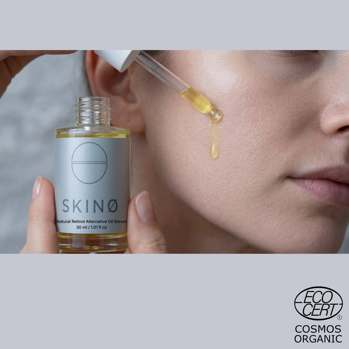 Droppe SKINØ Natural Retinol Alternative Oil Serum på kinden – oljeserum med bakuchiol, ett växtbaserat retinolalternativ